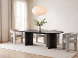 Anticoli 78-Inch Ebony Oak Pedestal Dining Set with 4 Boucle Armchairs in a bright plaster dining room with linen curtains