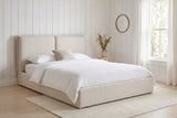 Anversa bed against whitewashed pine boards in a Hudson Valley farmhouse bedroom