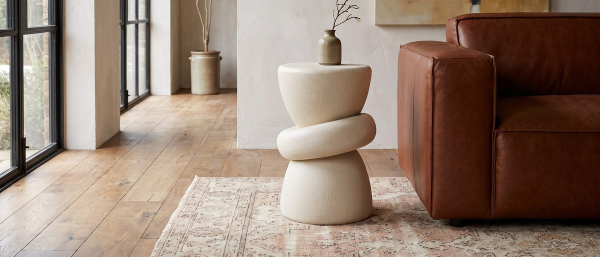 Altomonte Cream Fiberglass Stacked Side Table in the room