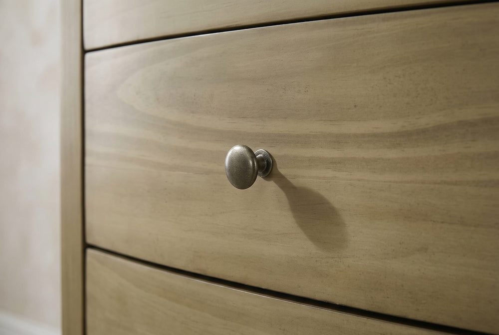 An antique nickel knob