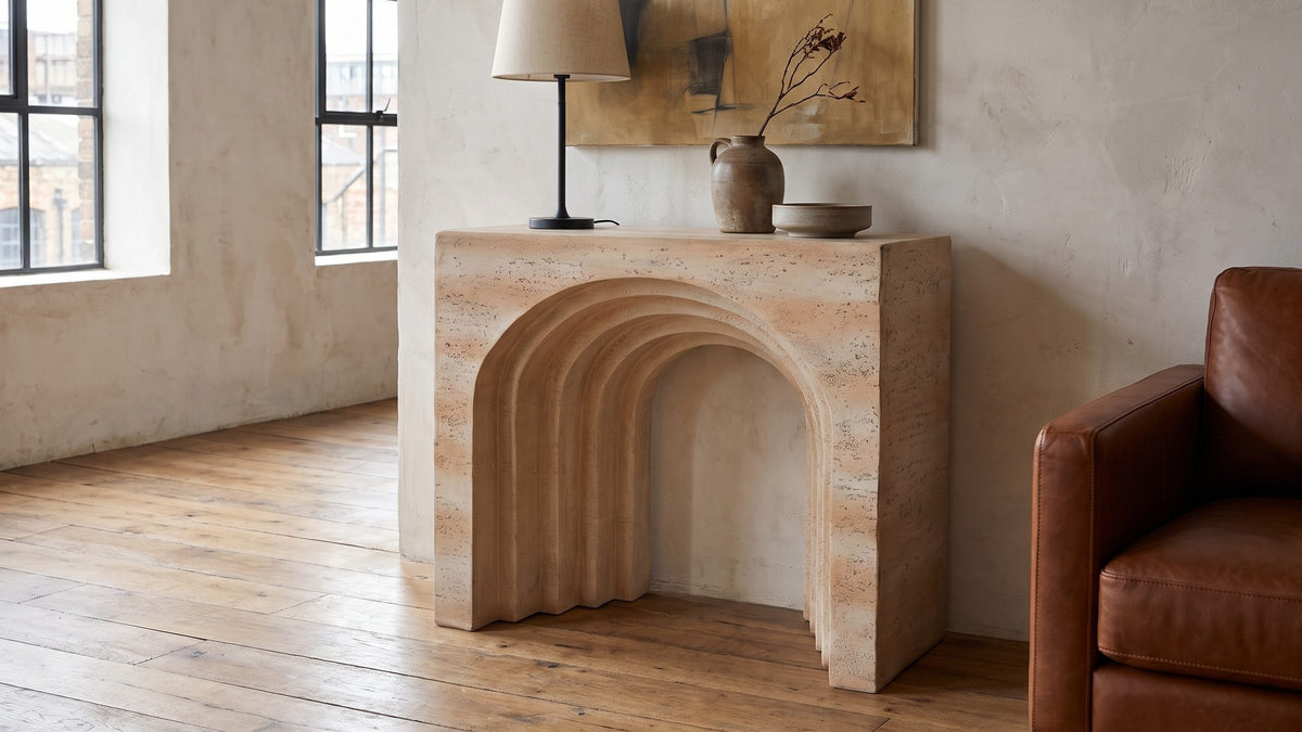Sand-toned, and sculptural. - Asiago Faux Travertine Arched Console Table