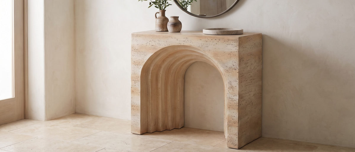 Asiago Faux Travertine Arched Console Table in the room