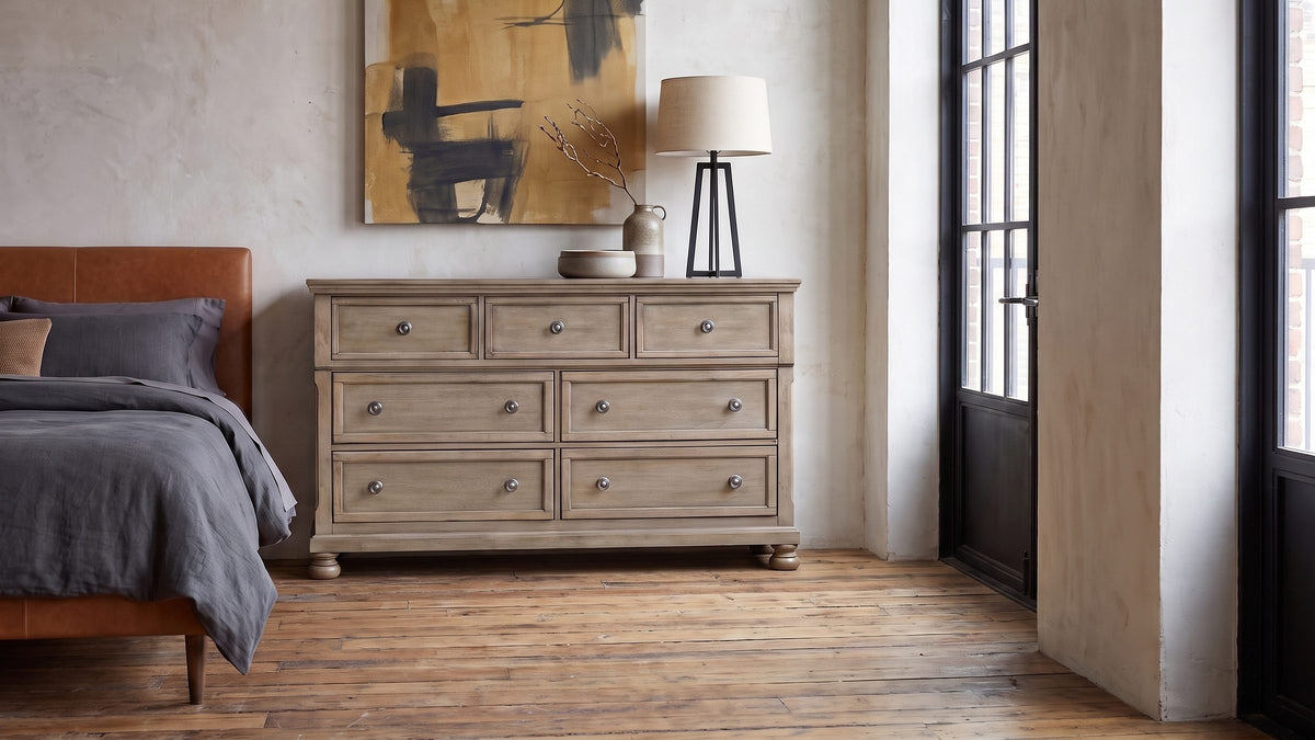 Soft gray, old-world lines. - Bassano 65-Inch Wire-Brushed Driftwood Gray 7-Drawer Dresser