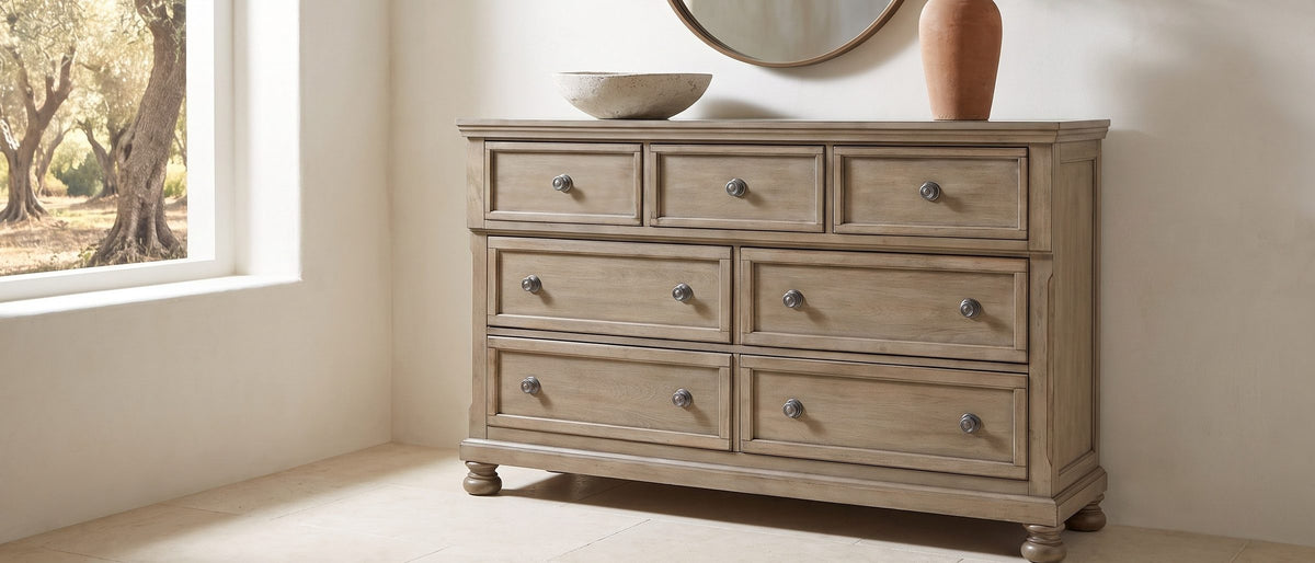 Bassano 65-Inch Wire-Brushed Driftwood Gray 7-Drawer Dresser in the room