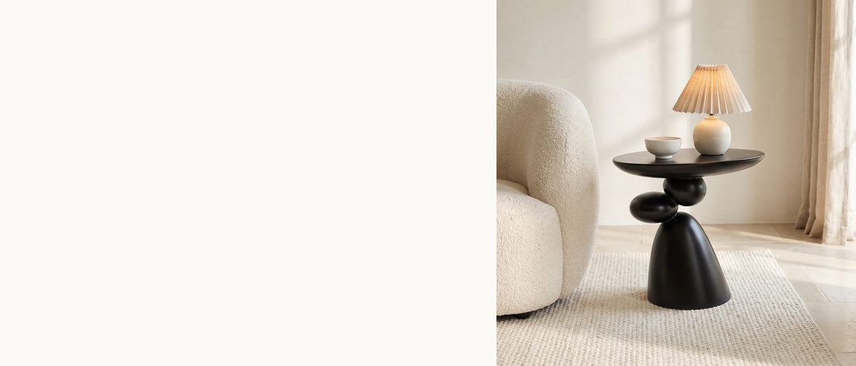 River stones, cast in black. - Bitetto Black Fiberglass Stacked Pebble Side Table