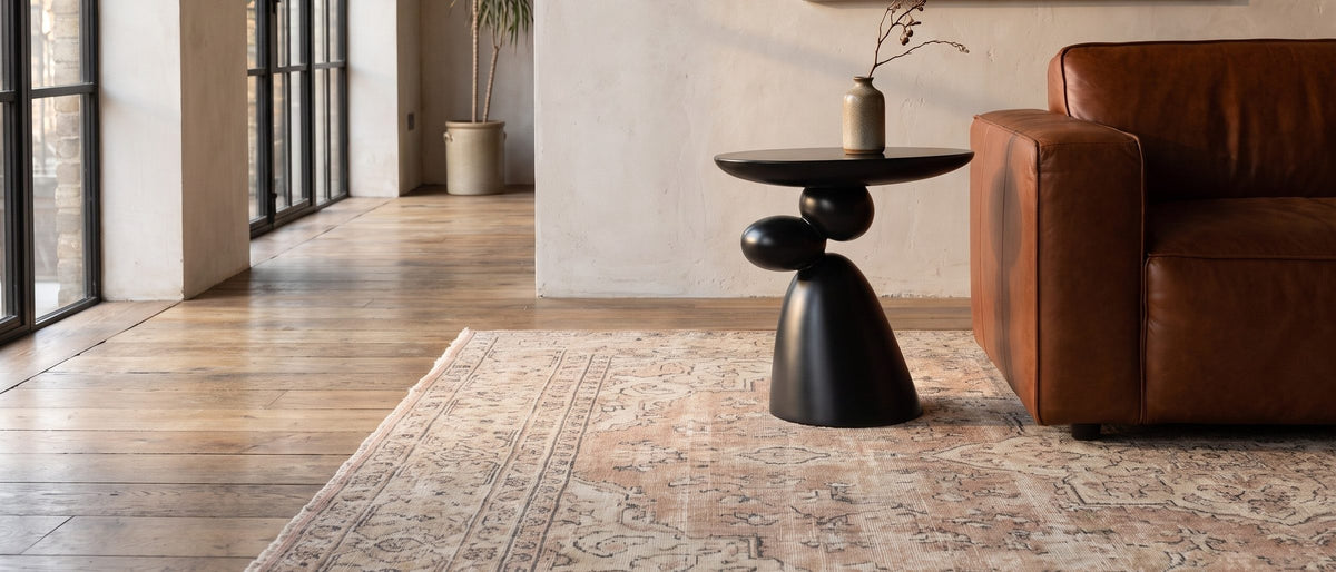 Bitetto Black Fiberglass Stacked Pebble Side Table in the room