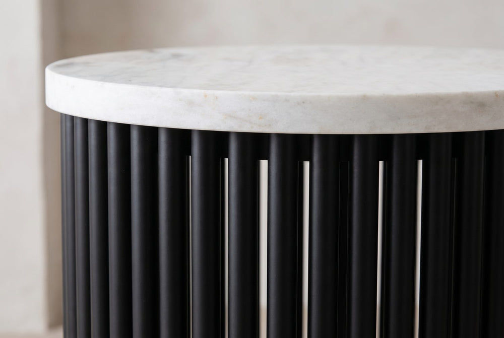 White marble over black metal