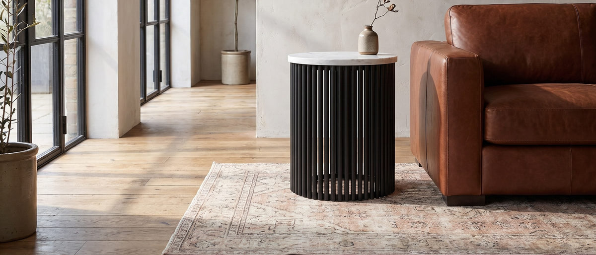 Camogli Marble and Black Metal Drum Side Table in the room