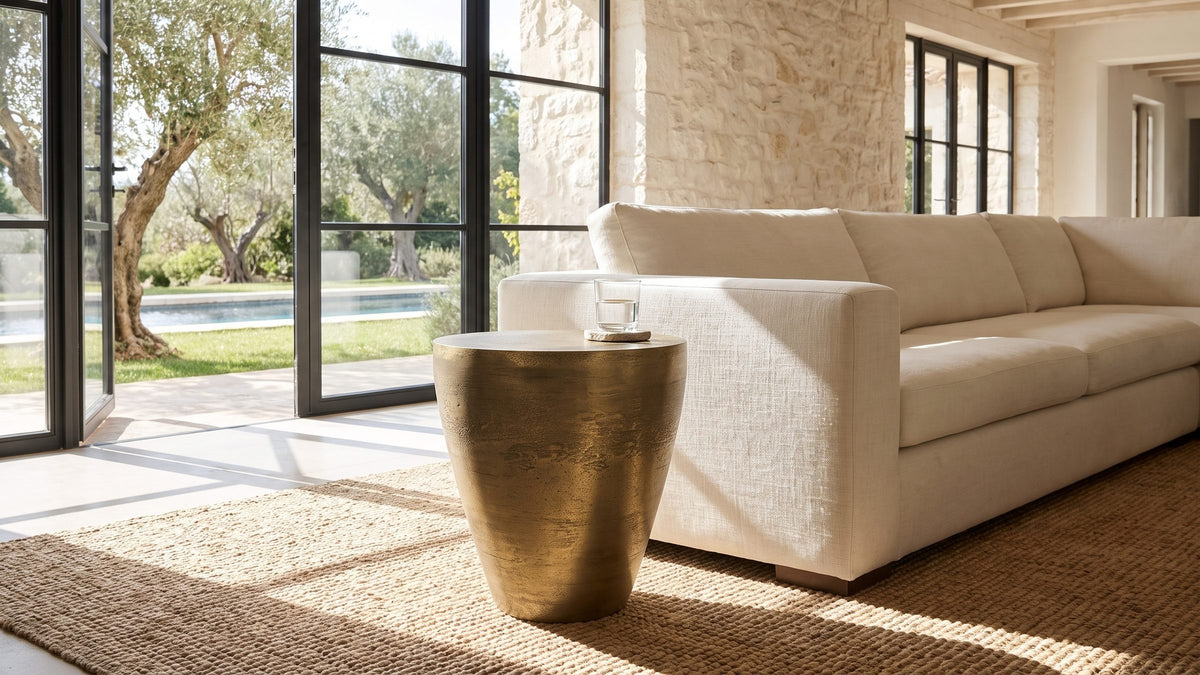 Warm metal in the corner. - Capestrano Antique Brass Cast Aluminum Drum Side Table