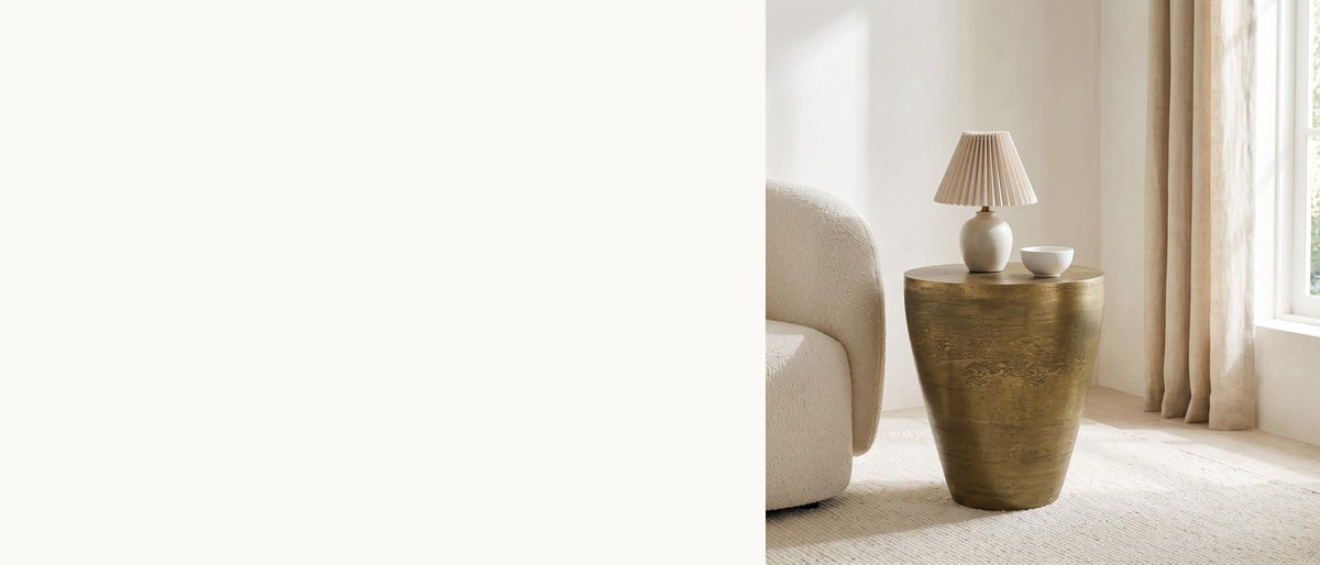 Cast metal, soft curve. - Capestrano Antique Brass Cast Aluminum Drum Side Table