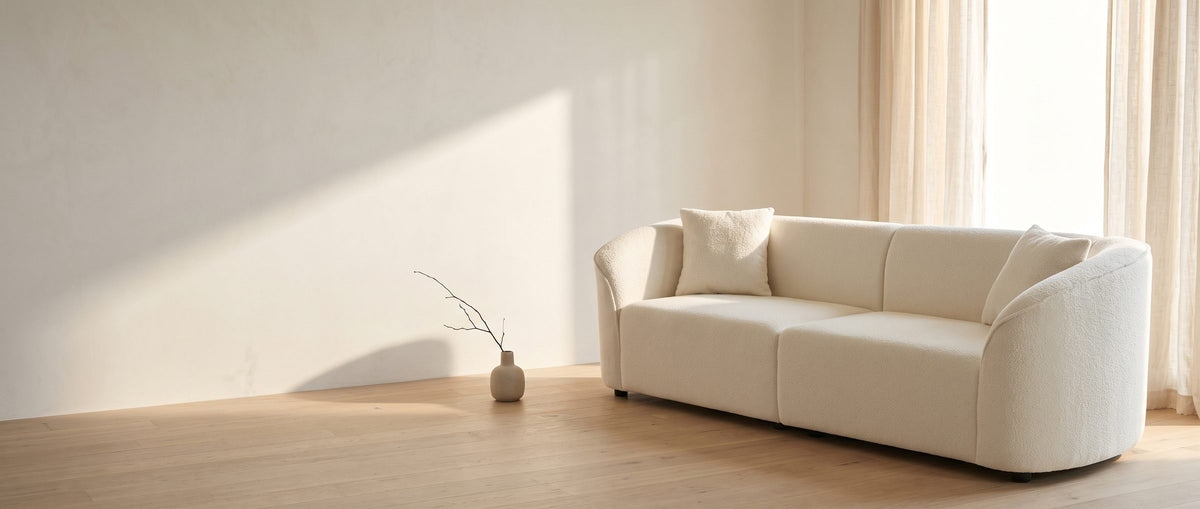 Soft lines, quiet presence. - Capri Curved Boucle Sofa
