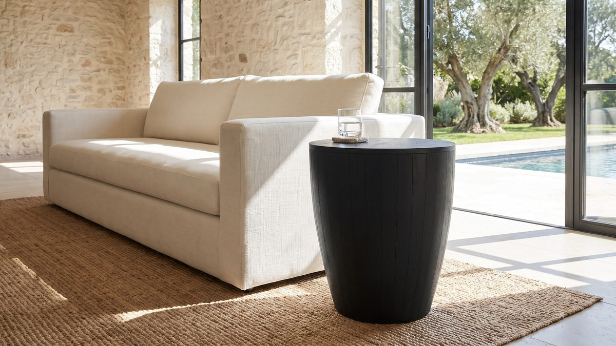 One dark form in a light room. - Caramanico Black Mango Tapered Drum Side Table