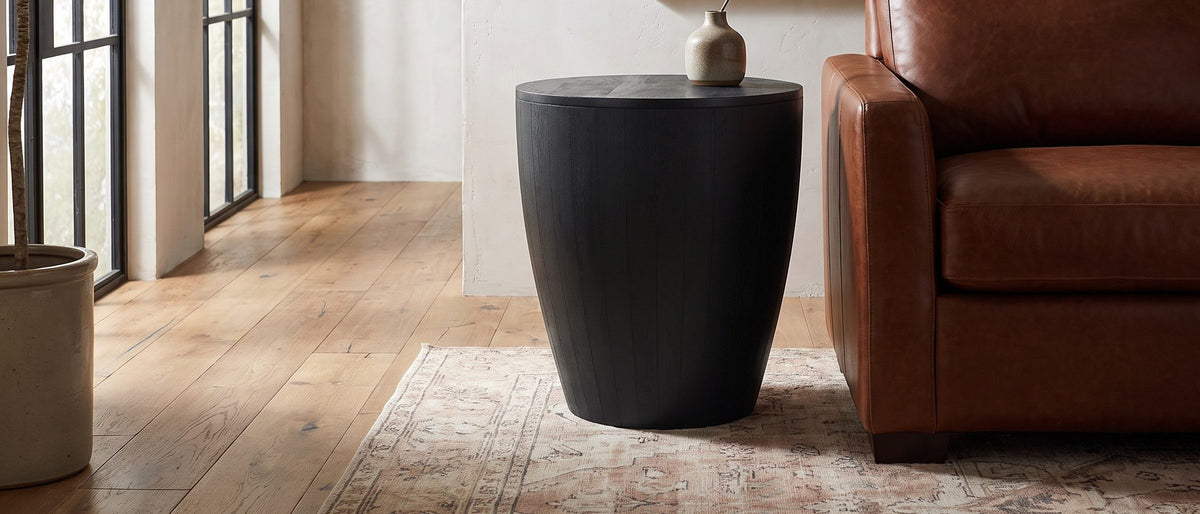 Caramanico Black Mango Tapered Drum Side Table in the room