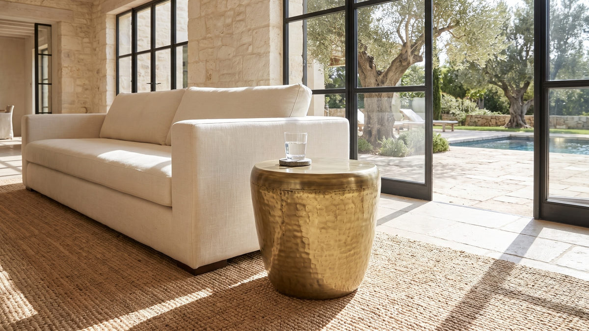 Warm metal, soft shine. - Carovilli Hammered Metal Drum Side Table