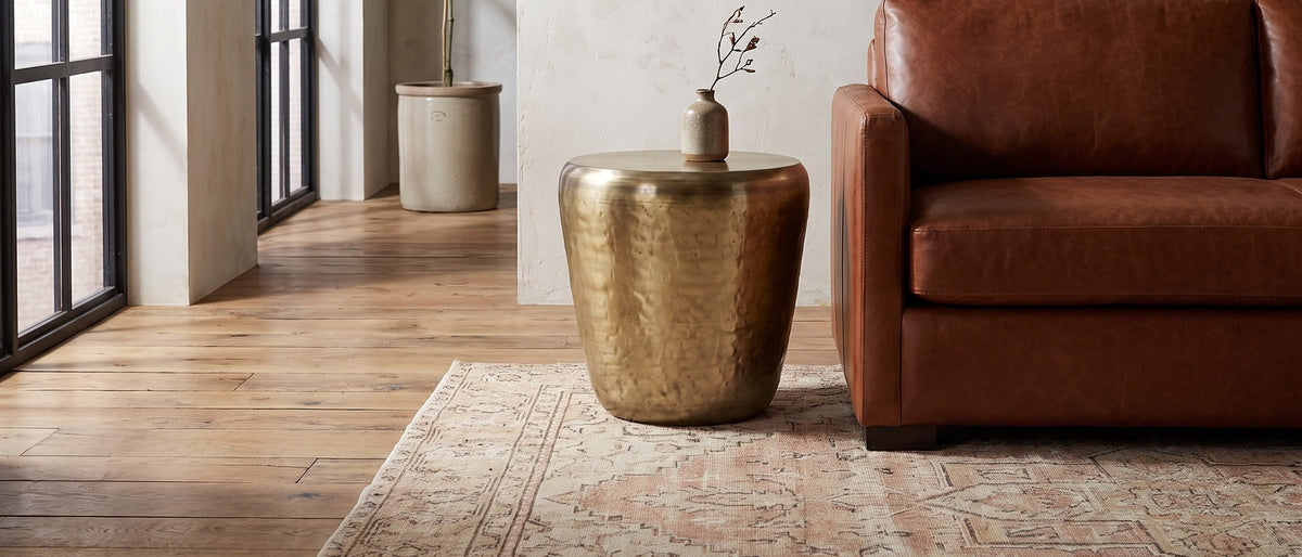 Carovilli Hammered Metal Drum Side Table in the room