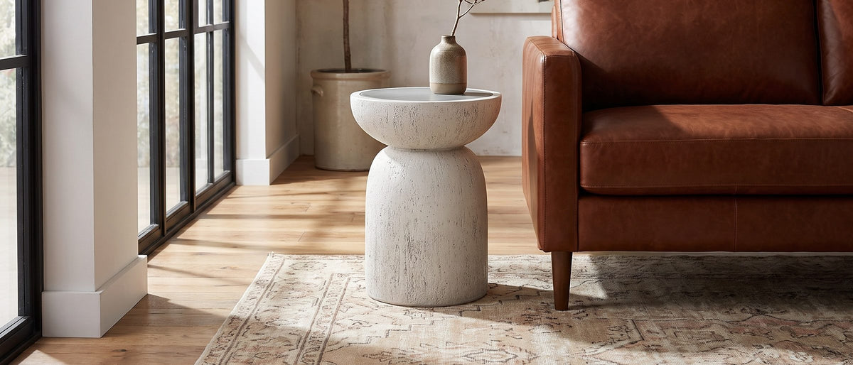 Casarano Fiber Concrete Hourglass Side Table in the room