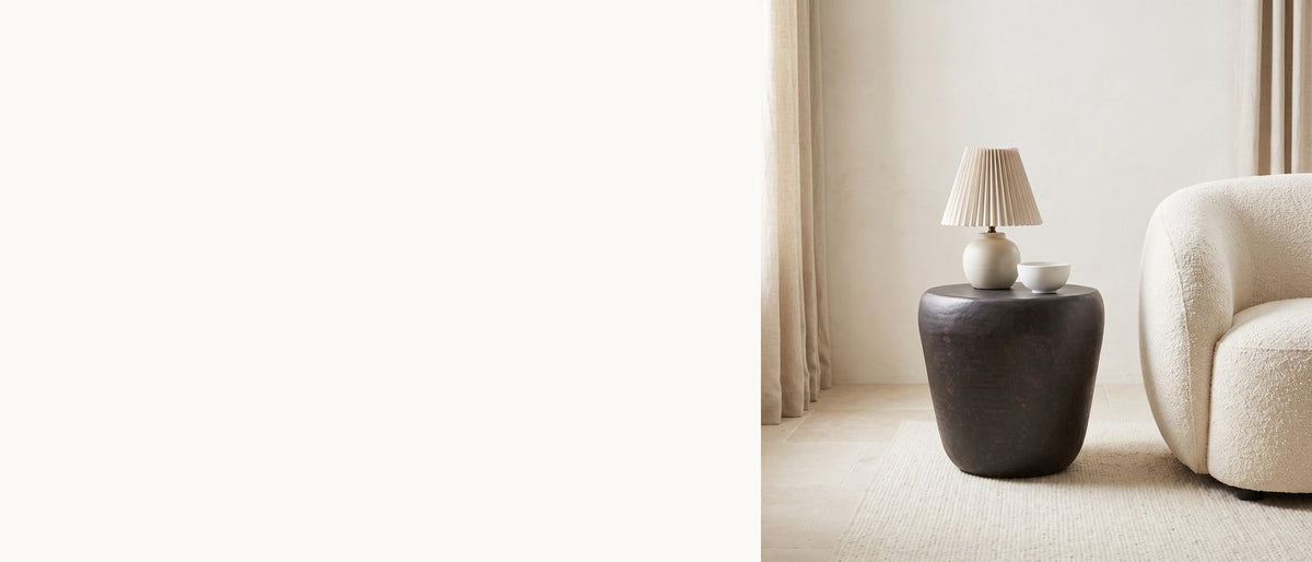 A dark bronze drum, softly hammered. - Cervara Rustic Bronze Metal Drum Side Table