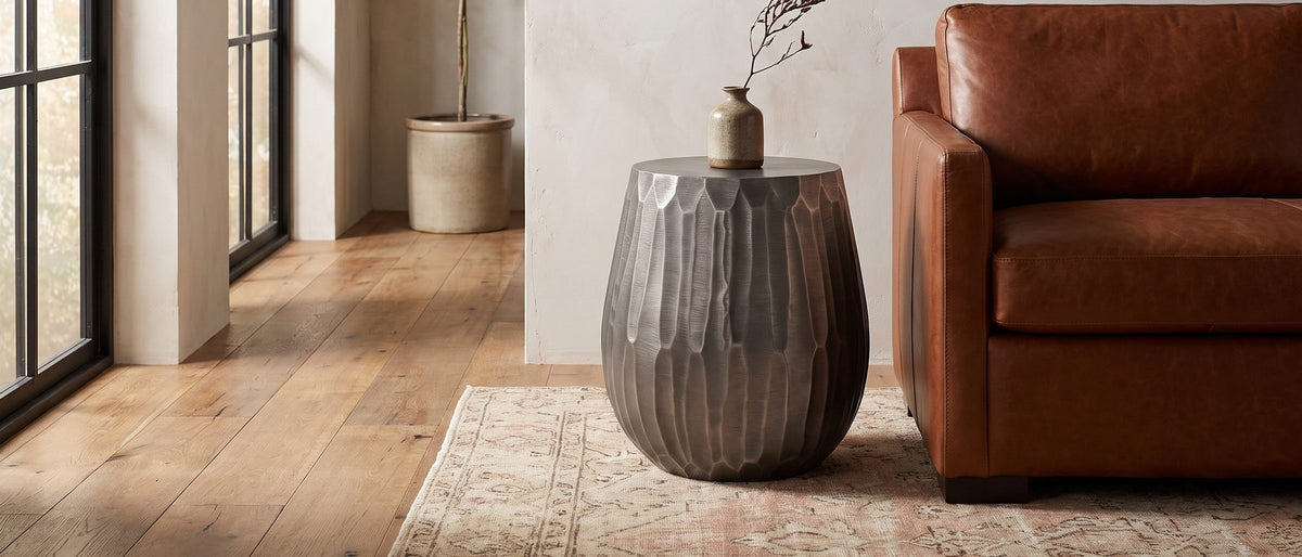 Chianciano Cast Aluminum Faceted Drum Side Table in the room