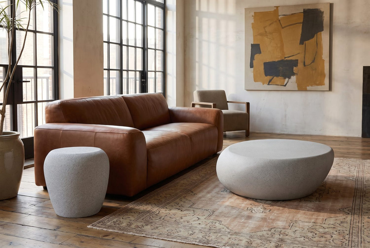 Cilento Grey Fiberglass Pebble Coffee Table and Side Table Set in the room