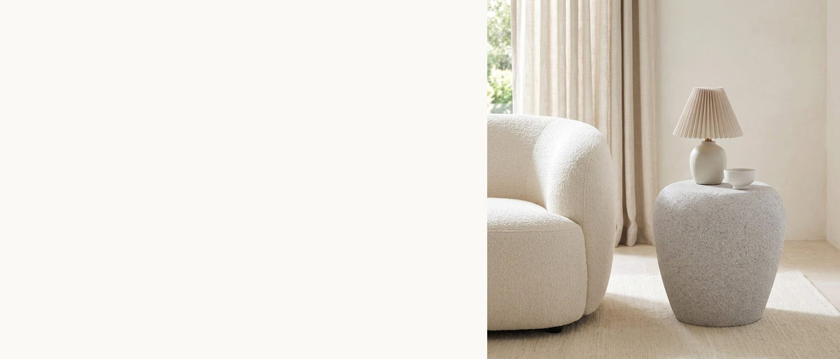 A river stone, speckled grey. - Cilento Speckled Grey Fiberglass Pebble Side Table