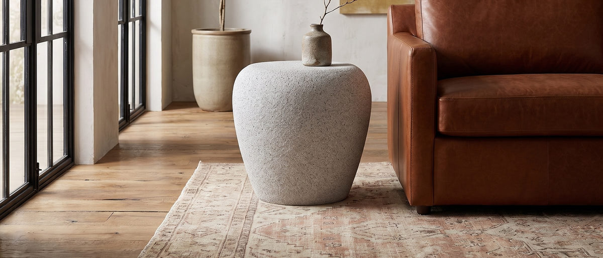 Cilento Speckled Grey Fiberglass Pebble Side Table in the room