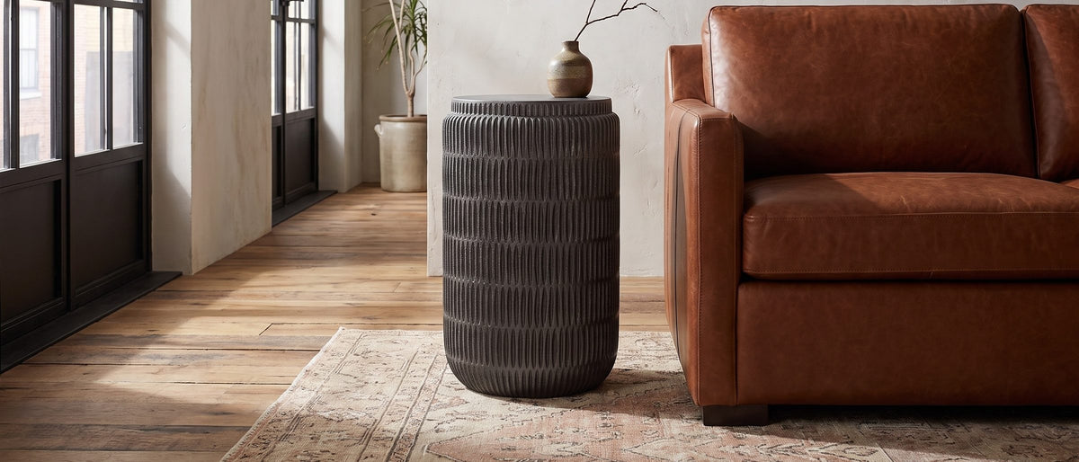 Cutigliano Cast Aluminum Carved Cylinder Side Table in the room