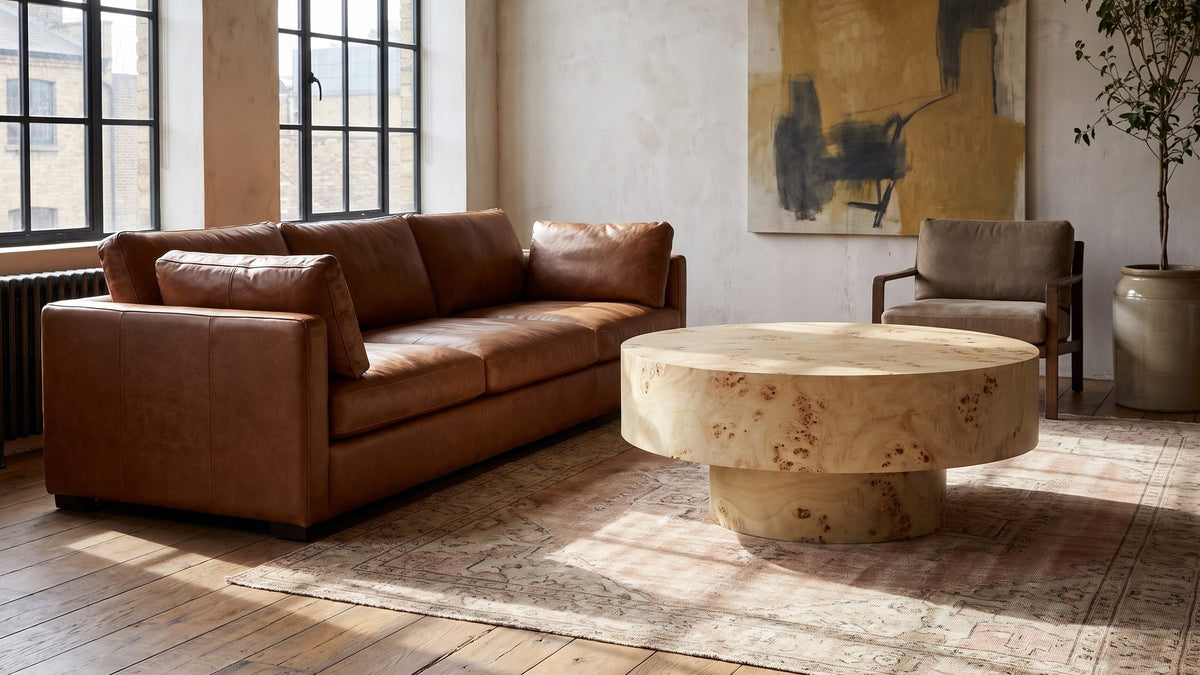 Soft figure, strong shape. - Fossano 31.5-Inch Round Burl Wood Veneer Pedestal Coffee Table