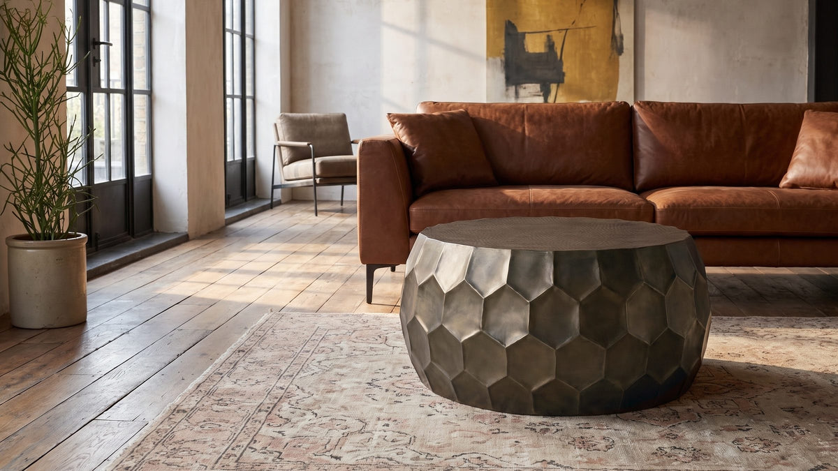 Bronze and leather, warm together. - Gavi 32-Inch Round Antique Bronze Faceted Aluminum Drum Coffee Table