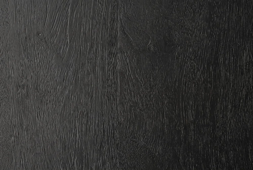 Black, with the grain showing