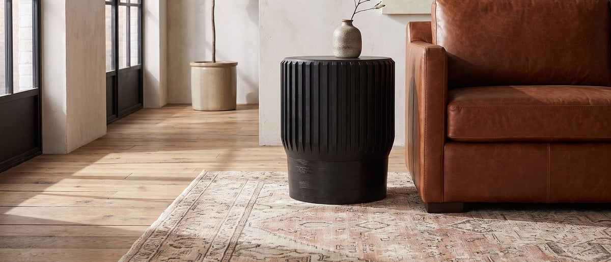 Grottole Black Mango Ribbed Drum Side Table in the room