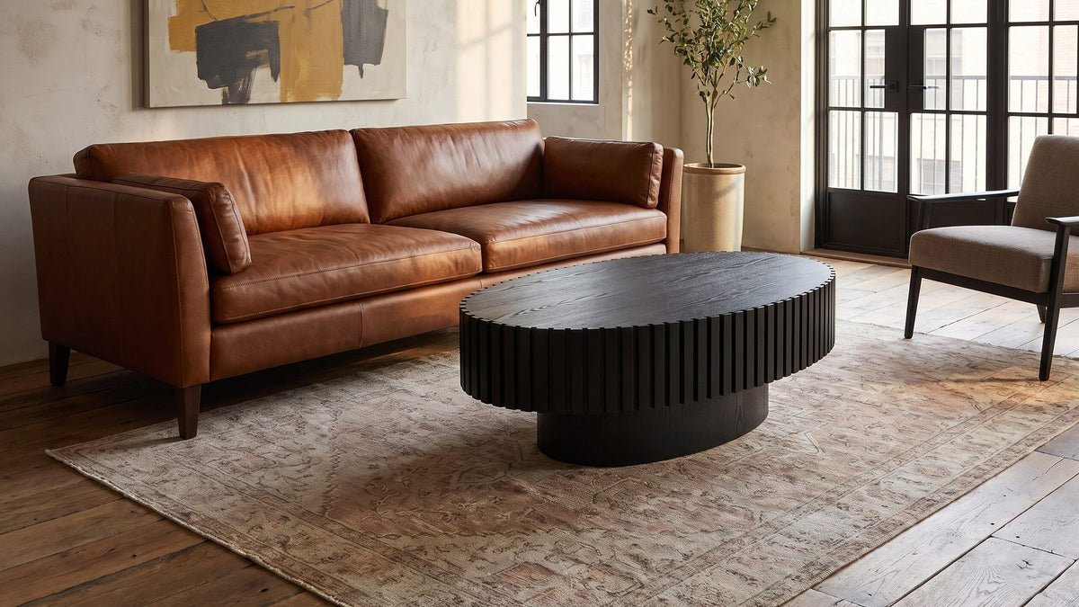 A dark centre, softly shaped. - Imola Black Ash Oval Pedestal Coffee Table