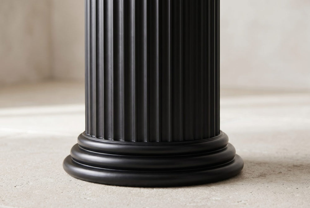 Fluted, on a stepped plinth