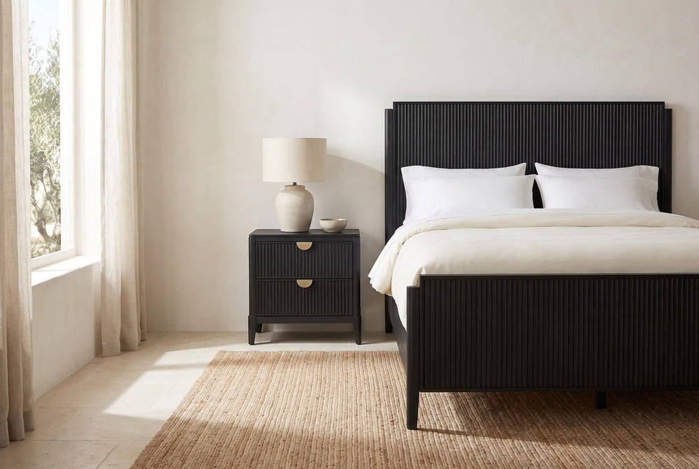 Beside the tall headboard