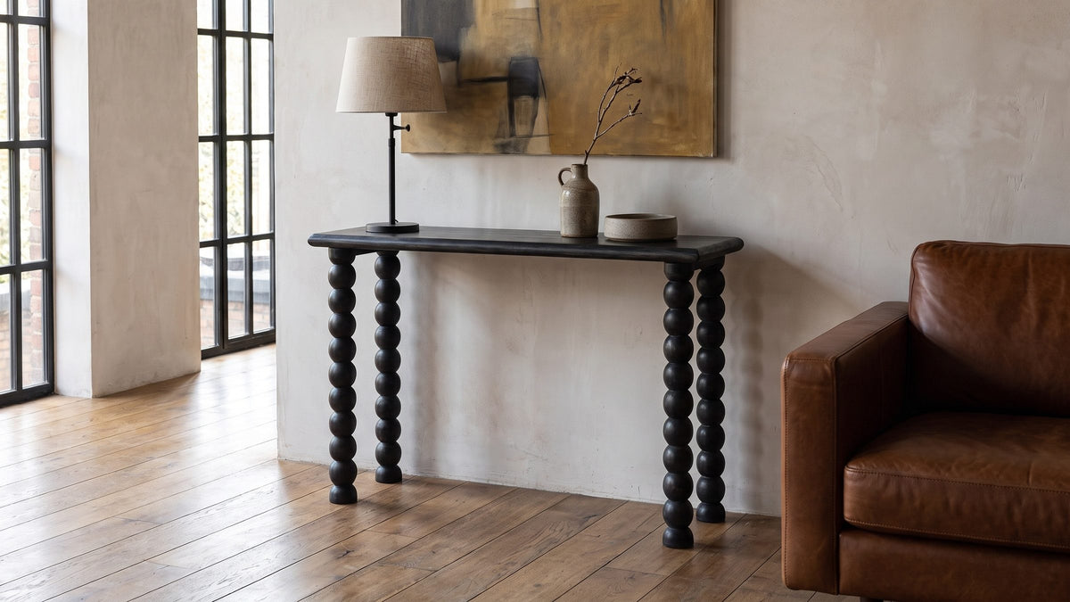 Dark wood, open underneath. - Lizzano Black Mango Wood Bobbin Console Table