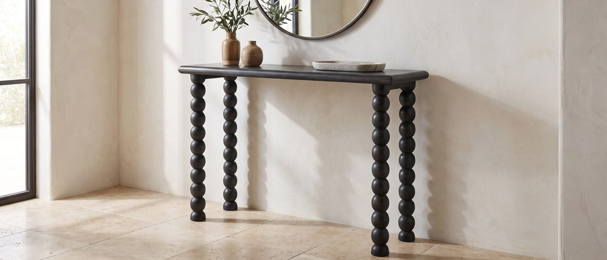 Lizzano Black Mango Wood Bobbin Console Table in the room