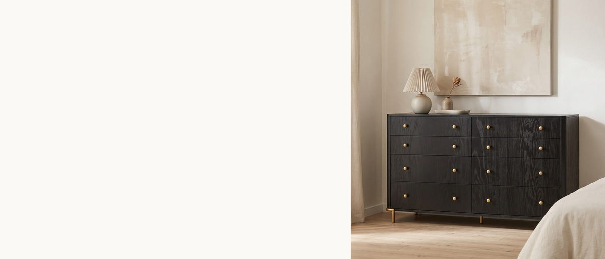 Dark wood, golden curves. - Malcesine 63-Inch Wire-Brushed Black 8-Drawer Dresser