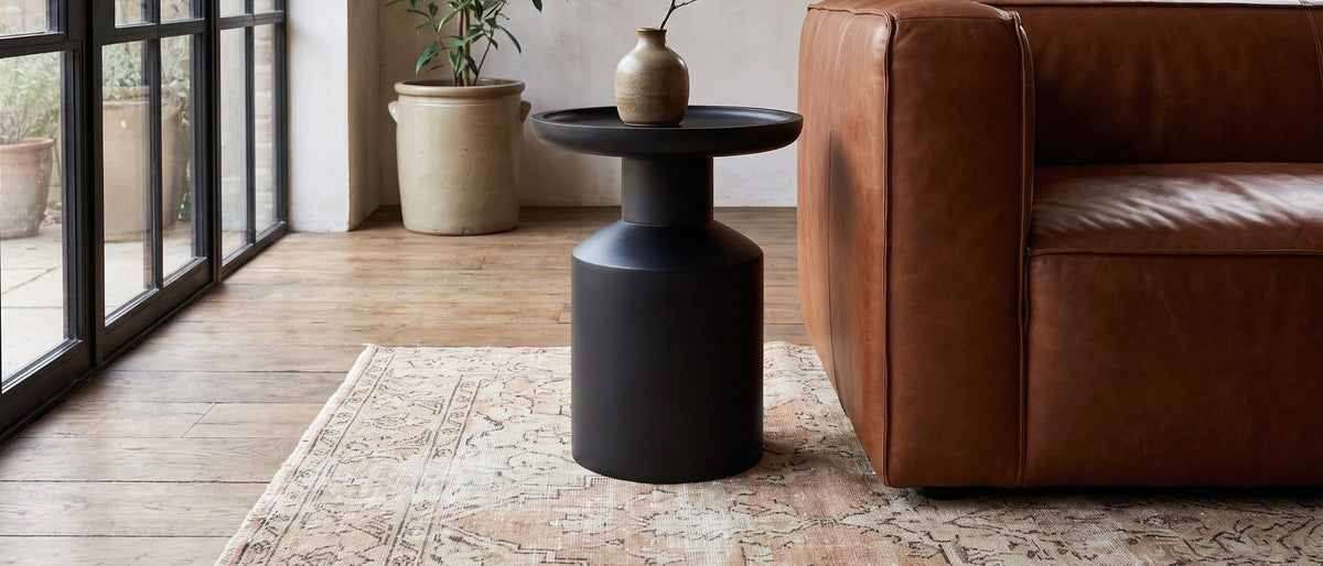 Mesoraca Black Mango Pedestal Side Table in the room