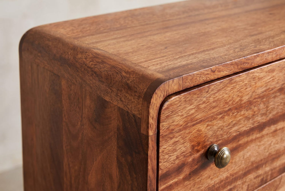 A curved corner, a brass knob