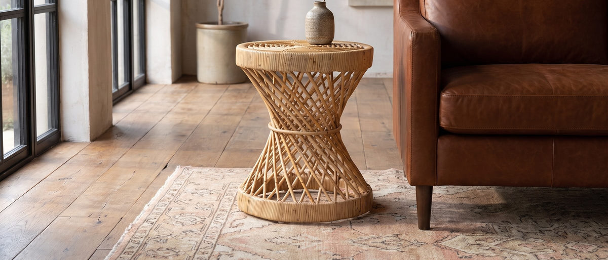 Neviano Natural Rattan Hourglass Side Table in the room