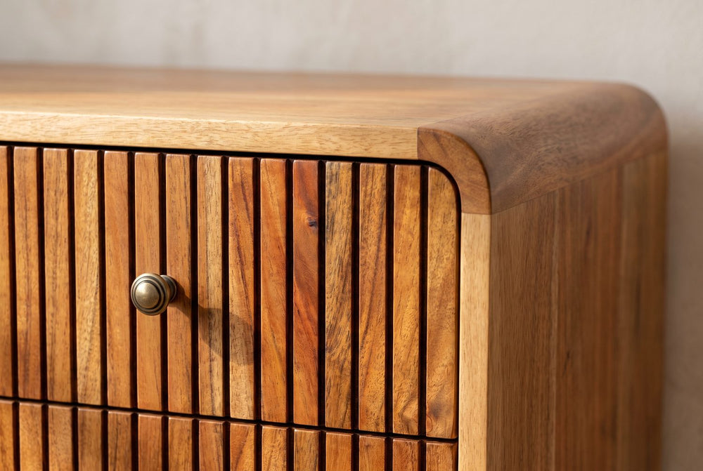 A rounded top, a brass knob