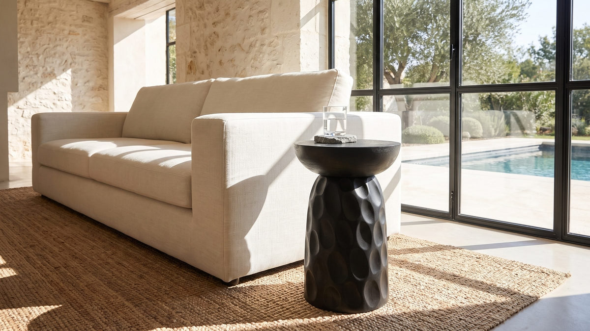 Matte black, softly dimpled. - Olevano Carved Black Mango Pedestal Side Table