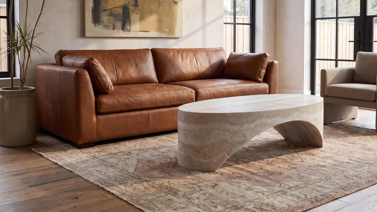An open arch in warm neutrals. - Orbetello Faux Travertine Oval Arch Coffee Table
