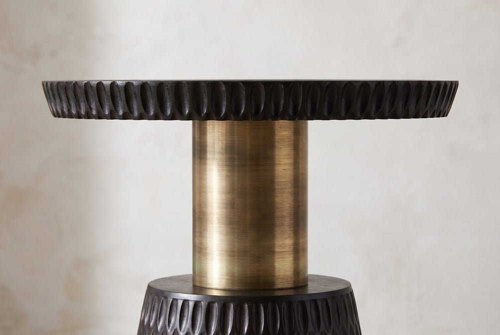 A tray on a gold stem