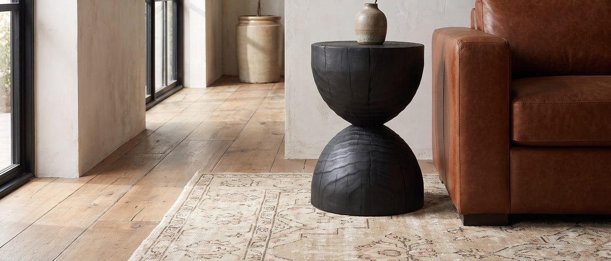 Orta Burnt Mango Hourglass Side Table in the room