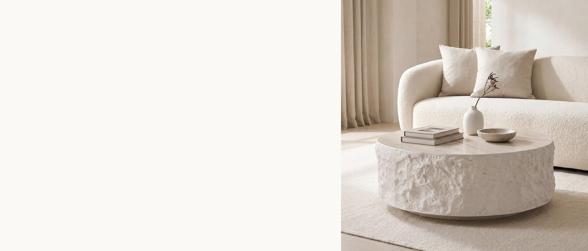 Rough sides, a quiet top. - Piombino Faux Travertine Fiberglass Drum Coffee Table