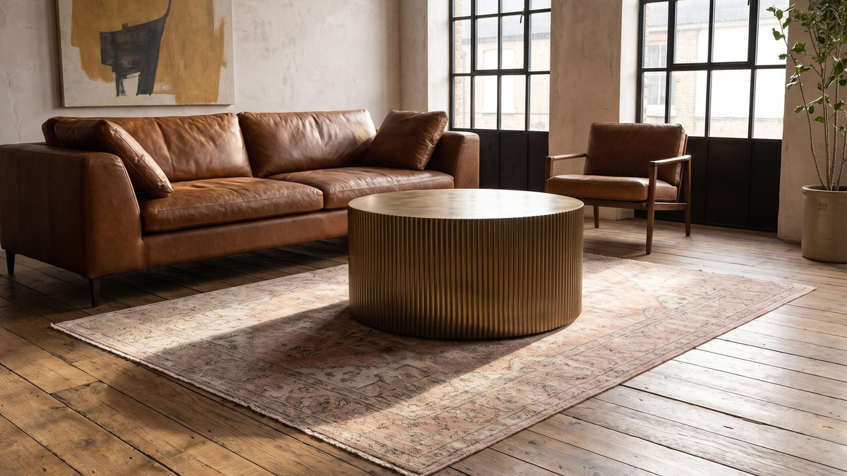 Warm metal tones, low and round. - Pitigliano Brass-Finish Fluted Drum Coffee Table