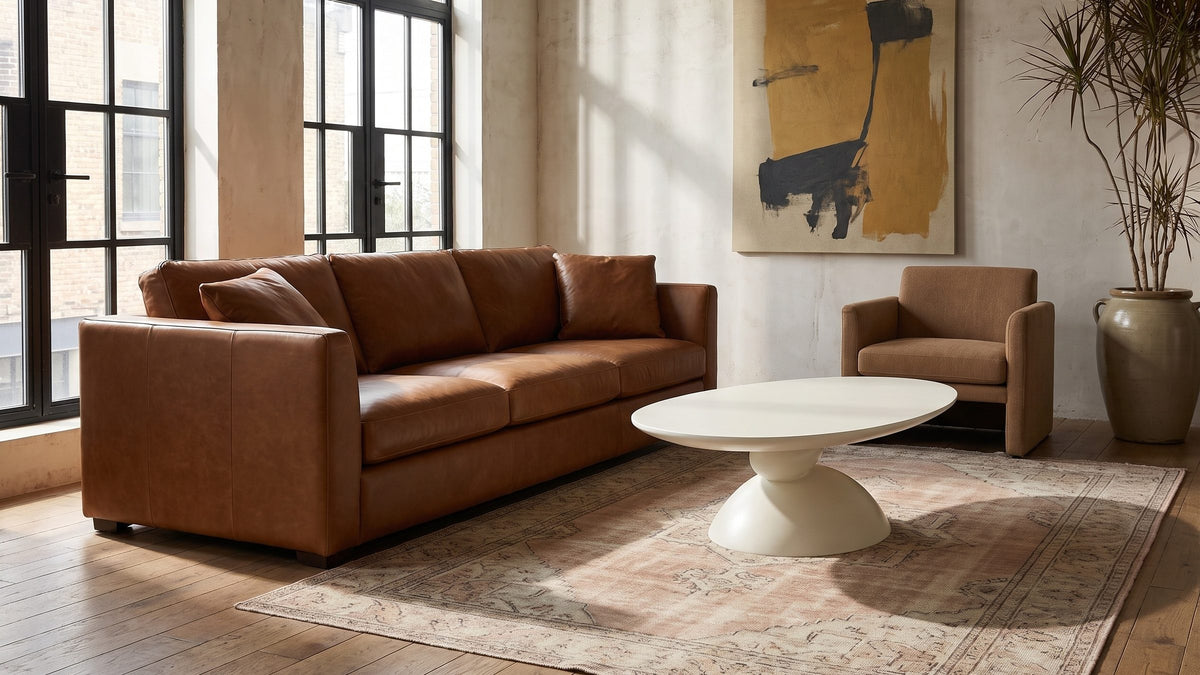 A soft white shape, low and long. - Ponza Milk White Fiberglass Pebble Coffee Table