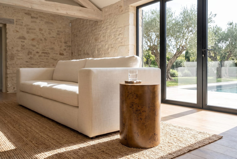 A plain drum beside the sofa