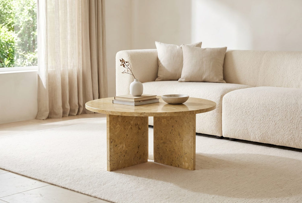 A gold disc over two slabs