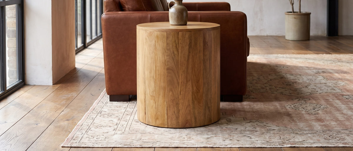 Sansepolcro Natural Mango Drum Side Table in the room